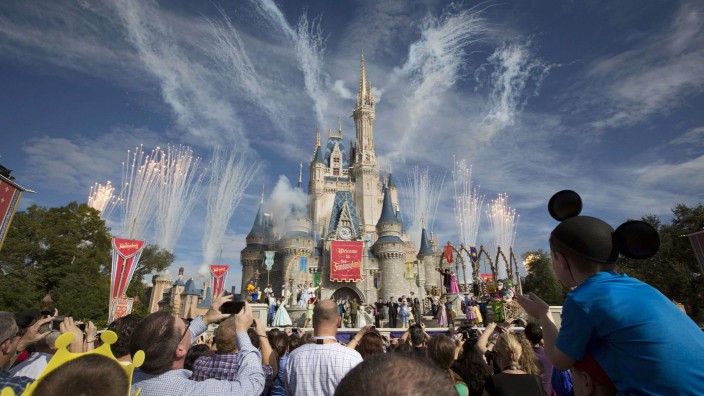 File of fireworks going off around Cinderella's castle during the grand opening ceremony for Walt Disney World's new Fantasyland in Lake Buena Vista, Florida