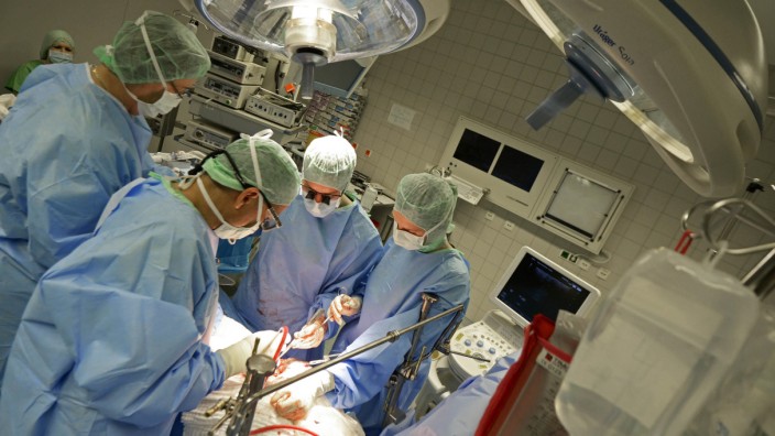 File photo shows Professor Oldhafer performing liver surgery with support of tablet computer at Asklepios Hospital Hamburg-Barmbek