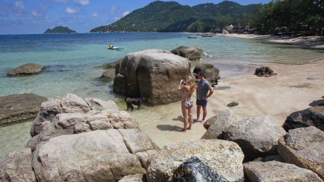 Tourists take pictures at the spot where bodies of two killed British tourists were found, on the island of Koh Tao