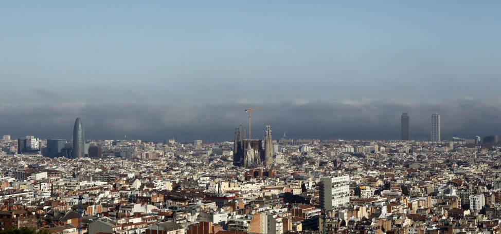 The Basilica Sagrada Familia is seen as fog gradually recedes in Barcelona; Sagrada Familia
