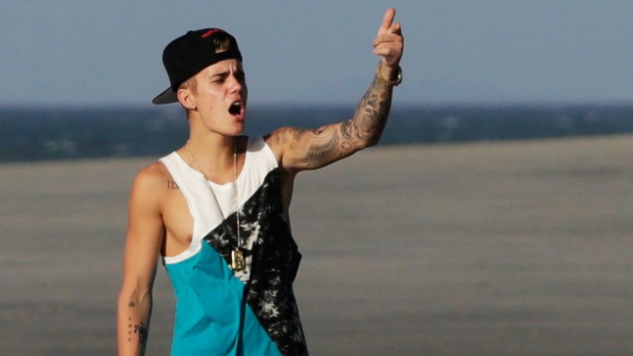 Justin Bieber gestures at a beach as he takes a break in a resort in Punta Chame, on the outskirts of Panama City