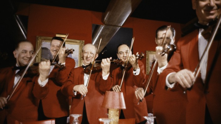 Restaurant musicians playing violins
