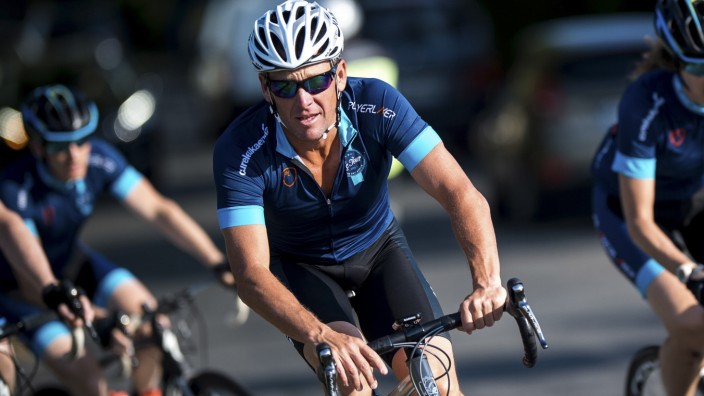 Cyclist Lance Armstrong of the US cycles with a team of riders as he takes part in Geoff Thomas's 'One Day Ahead' charity event during a stage of the 102nd Tour de France cycling race from Muret to Rodez