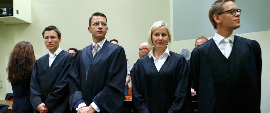 Defendant Zschaepe stands next to her lawyers Grasel, Stahl, Sturm and Heer at courtroom in Munich