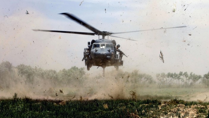 A U.S. Army Black Hawk helicopter lands for medevac in Arghandab valley near Kandahar