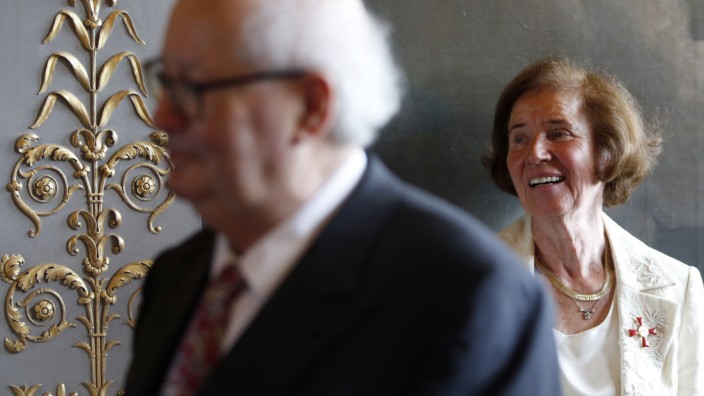 Nazi hunters Beate Klarsfeld and Serge Klarsfeld react after being awarded by German ambassador to France at her residence in Paris