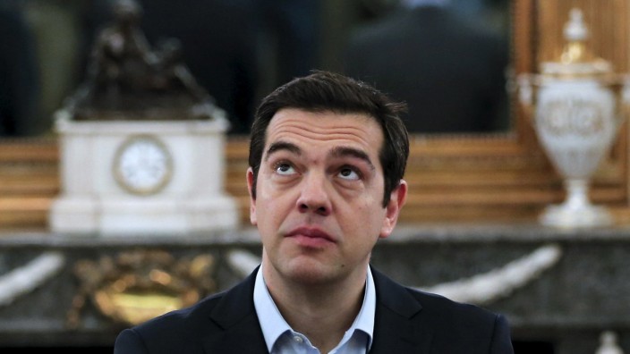 Greek PM Tsipras looks on during a swearing in ceremony of members of his government at the Presidential Palace in Athens