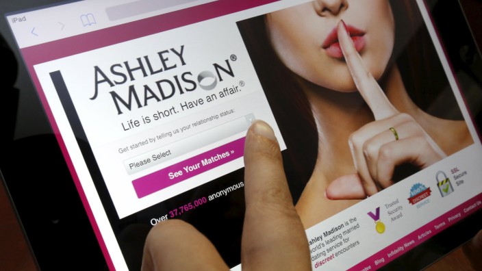 Homepage of Ashley Madison website displayed on iPad, in photo illustration taken in Ottawa