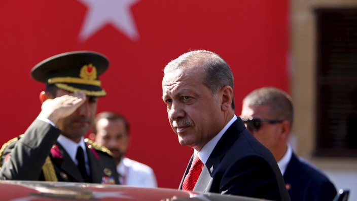 Turkey's President Tayyip Erdogan looks on durin his visit to Northern Cyprus