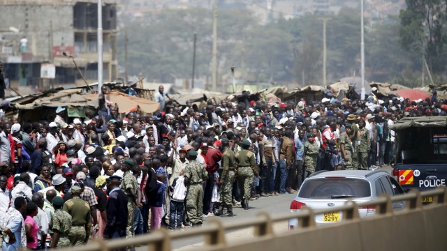 Crowds line the motorcade route as Obama travels to deliver remarks at an indoor stadium in Nairobi