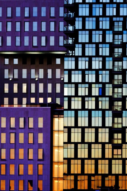 The sunset is reflected off the buildings of The Barcode Project in Oslo