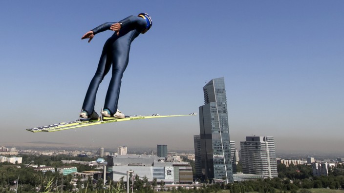 A skier soars through the air during training session at the Sunkar Ski Jumping complex in Almaty