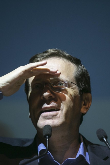 Herzog pauses during an address to young voters in Tel Aviv