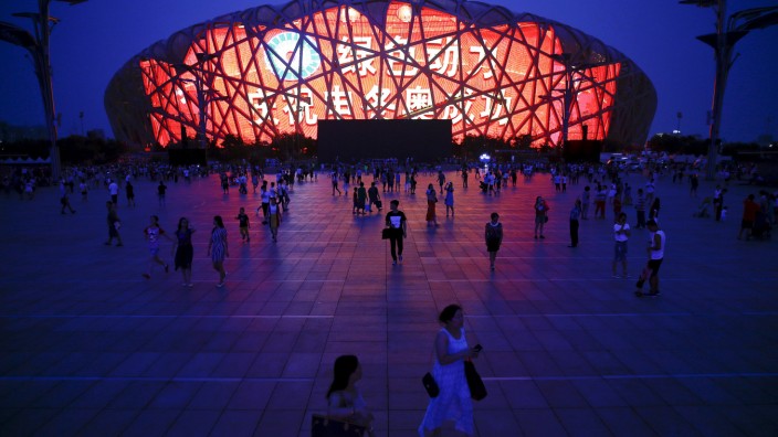 A message of congratulation is projected onto the Bird's Nest Olympic stadium as people gather after Beijing was chosen to host the 2022 Winter Olympics in Beijing