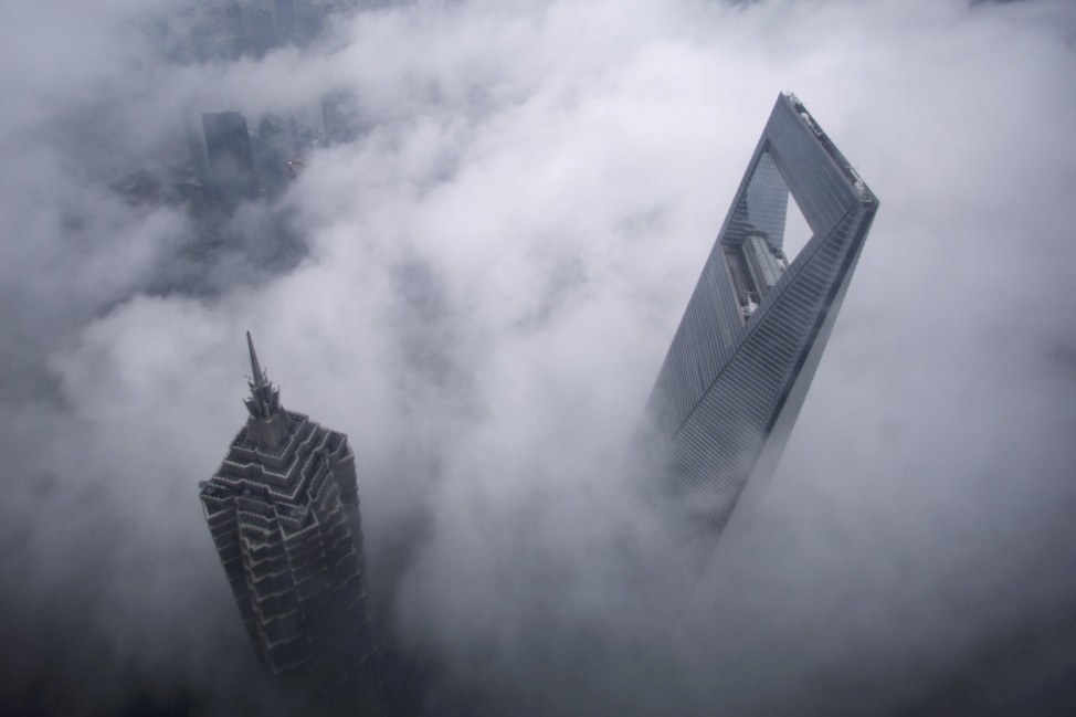 File photo of skyscrapers Shanghai World Financial Center and Jin Mao Tower during heavy rain at the financial district of Pudong in Shanghai