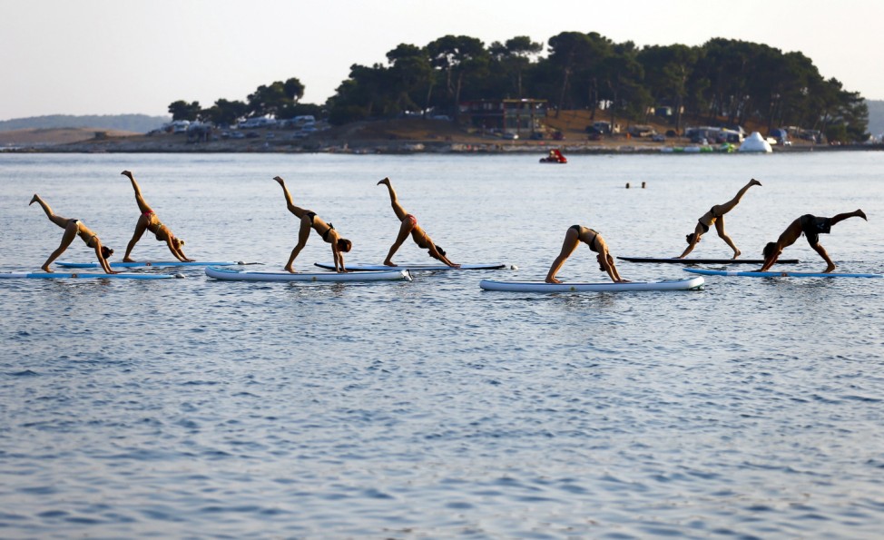 People practise Metta Float Yoga at the adriatic cost in Meduli