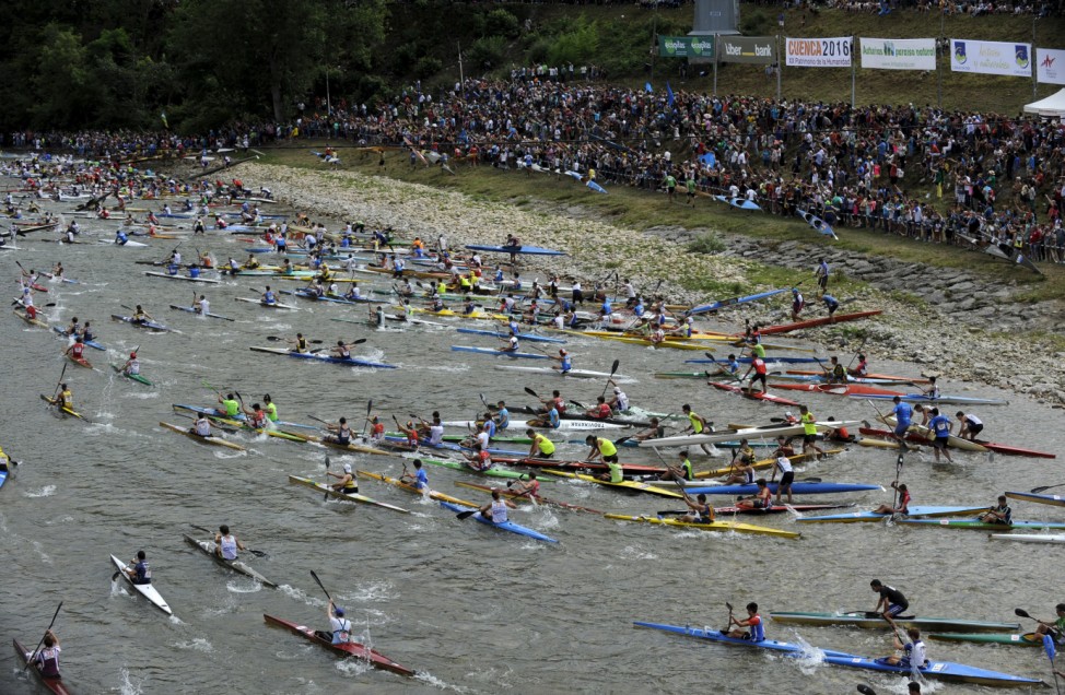 Canoeists start the annual International Descent of the Sella river