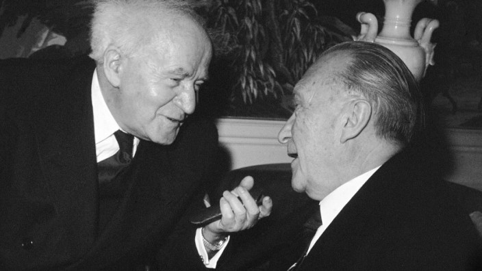 Israel's Premier David Ben-Gurion, left, converses with West German...