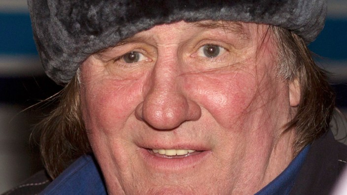 Actor Depardieu wears a traditional Russian hat, also known as a Ushanka hat, during a welcoming ceremony at the airport in Grozny
