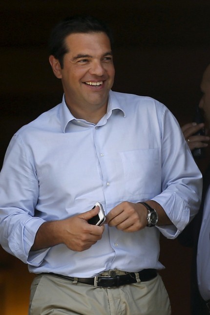 Tsipras leaves his office at Maximos Mansion in Athens