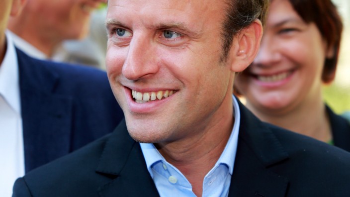 Emmanuel Macron: French Minister of Economy and Industry Emmanuel Macron arrives at the 'Pole des reformateurs' (Reformer's Centre) meeting in Leognan near Bordeaux, southwestern France on August 27, 2015. AFP PHOTO / NICOLAS TUCAT