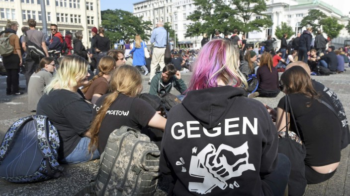 A left-wing protestor wearing a shirt reading: ' Against Nazis ' takes part in a  demonstration against a Nazi demonstration, which was forbidden by authorities, in Hamburg