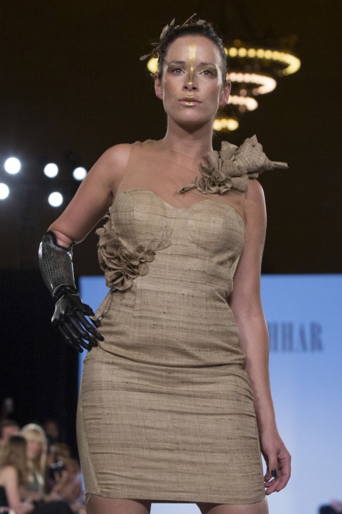 Rebekah Marine, a model with a bionic arm, presents a creation from Archana Korchhar during the FTL Moda presentation of the Spring/Summer 2016 collection during New York Fashion Week in Vanderbilt Hall at Grand Central Station, New York