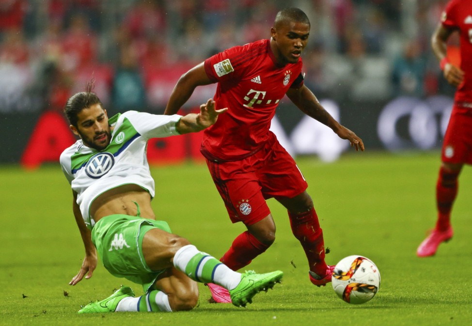 Bayern Munich's Costa and Wolfsburg's Rodriguez fight for the ball during their German first division Bundesliga soccer match in Munich