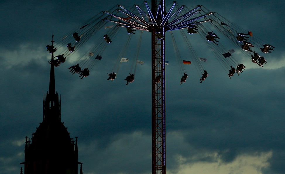 Visitors ride a merry-go-round during the opening day of the 182nd Oktoberfest in Munich