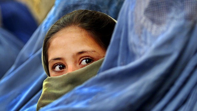 File photo of an Afghan girl waiting on a street in Kabul
