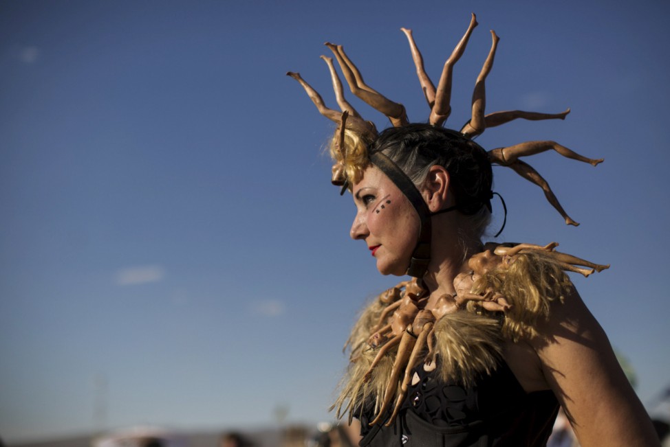 Enthusiast Ellquist, dressed as 'Auntie Virus,' poses for a portrait during Wasteland Weekend event in California City
