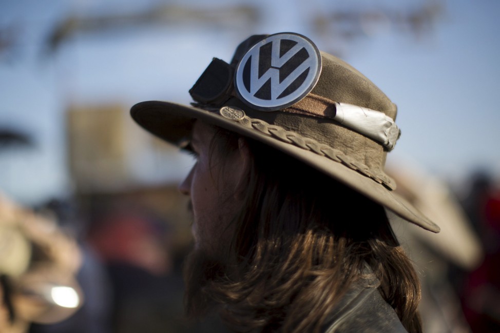 An enthusiast wears a Volkswagen logo on his hat at the Wasteland Weekend event in California City