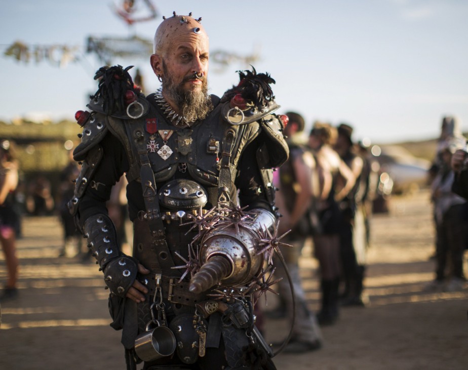 Enthusiast McKinnon, dressed as 'Pez Brother of Wez,' poses for a portrait during Wasteland Weekend event in California City