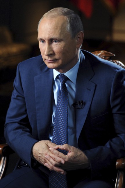 Russian President Vladimir Putin gives an interview in Moscow region