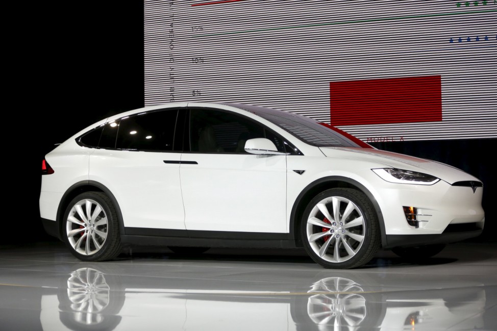 A Tesla Motors Model X electric sports-utility vehicles is seen on stage a presentation in Freemont