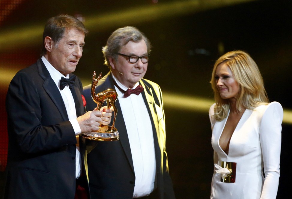 Critic Karasek and singer Fischer present Juergens with trophy for Lifetime Achievement during Bambi 2013 media awards ceremony in Berlin