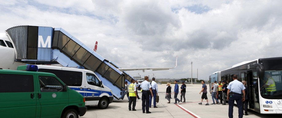 Albanian and Kosovo refugees enter an airplane to Tirana and Prishtina at Munich airport