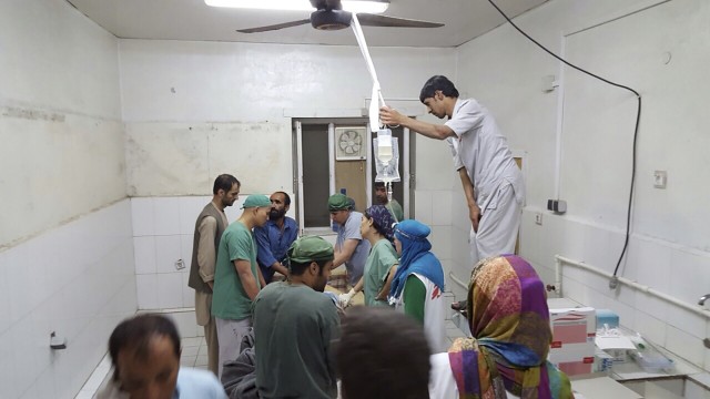 Afghan (MSF) surgeons work inside a Medecins Sans Frontieres (MSF) hospital after an air strike in the city of Kunduz, Afghanistan