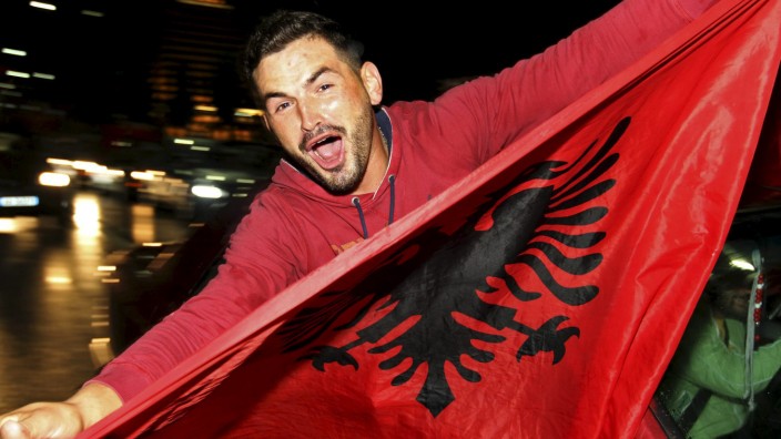An albanian soccer fan celebrate in Tirana