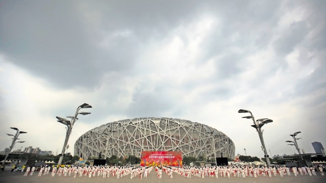 Report: Für das Pekinger Olympiastadion lieferte der Konzern später Mörtel und Glaswolle.