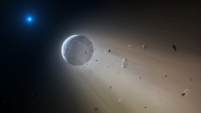 Astronomie: Im fernen Sternsystem WD 1145+017 wurde ein Planet von der Schwerkraft seines Sterns zerrissen, hier eine zeichnerische Darstellung der Szene.