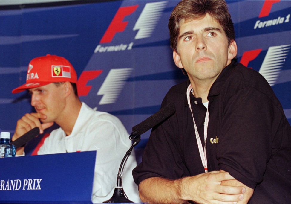 DAMON HILL AND MICHAEL SCHUMACHER AT A PRESS CONFERENCE IN SILVERSTONE