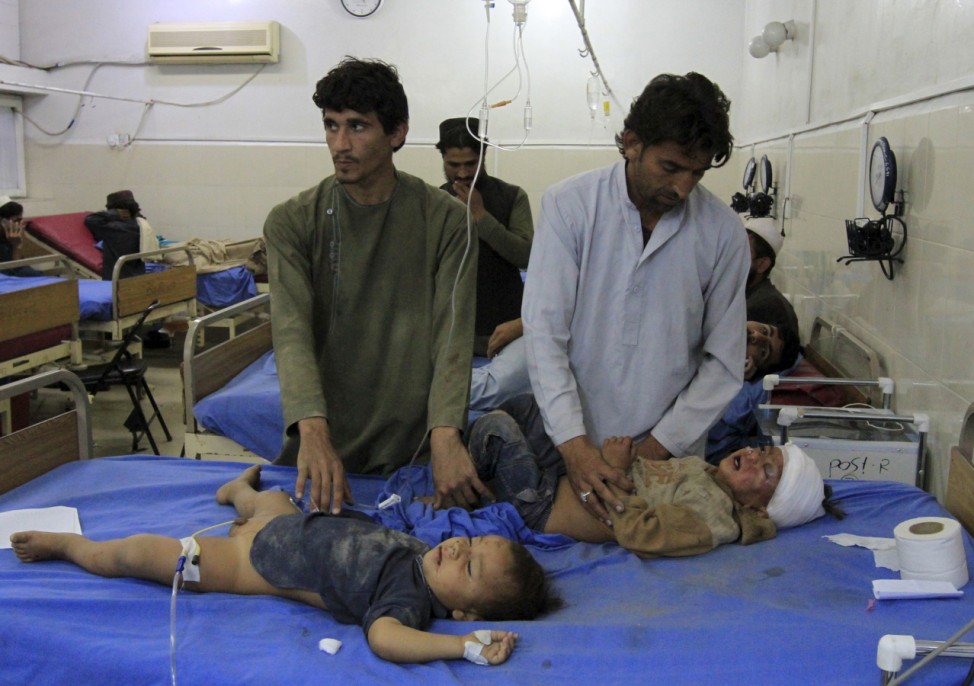 Afghan children receive treatment at a hospital after an earthquake in Jalalabad, Afghanistan