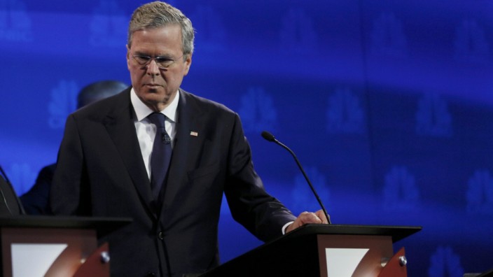 Republican U.S. presidential candidate and former Florida Governor Jeb Bush pauses at his podium in the midst of a commercial break at the 2016 U.S. Republican presidential candidates debate held by CNBC in Boulder