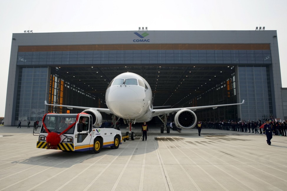 The first C919 passenger jet made by the Commercial Aircraft Corp of China (Comac) is pulled out during a news conference at the company's factory in Shanghai