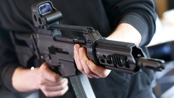 A man holds a G 36 KA rifle manufactured by Heckler & Koch at arms factory in Oberndorf