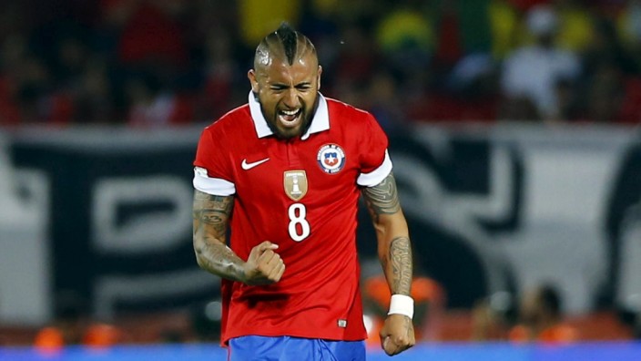 Chile's Vidal celebrates a goal against Colombia during their 2018 World Cup qualifying soccer match at the national Julio Martinez stadium in Santiago