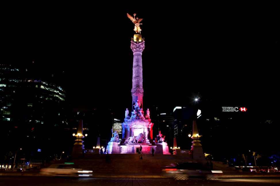 Angel de la Independencia monument is lit up in blue, white and red, the colors of the French flag, following the Paris terror attacks, in Mexico City