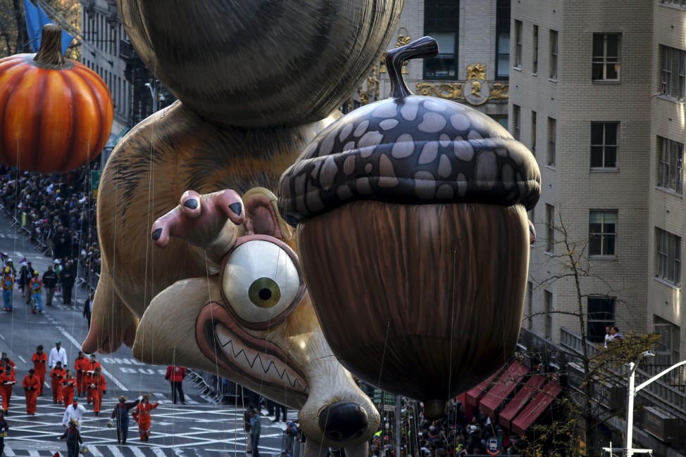 The 'Ice Age Scrat' balloon makes its way down 6th Avenue during the 89th Macy's Thanksgiving Day Parade in the Manhattan borough of New York