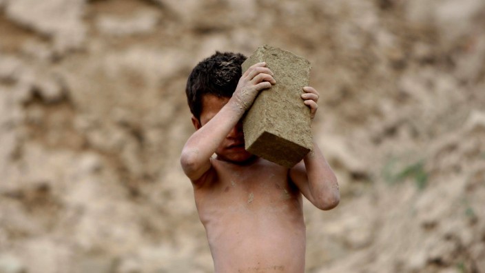 150803 KABUL Aug 3 2015 An Afghan child works at a brick factory on the outskirts of Kabu
